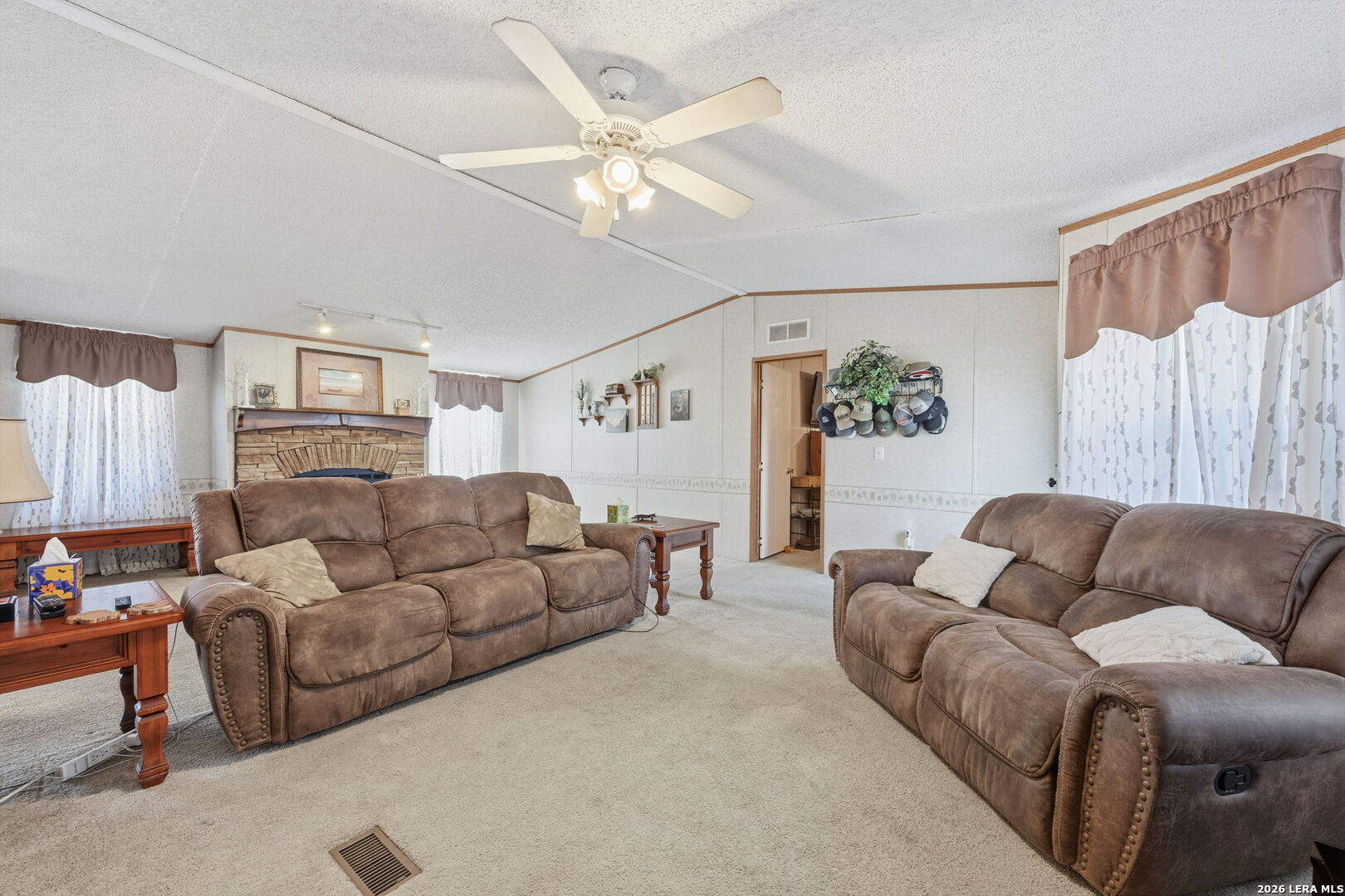 708 Mesquite Street Jourdanton, TX 78026 - Photo 9 of 49 a living room with furniture a bed and a couch