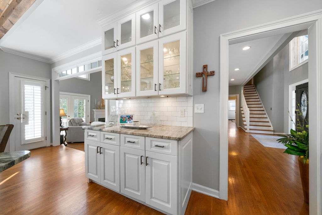 111 Warwick Way Rome, GA 30161 - Photo 12 of 46 a kitchen with a stove and wooden floor