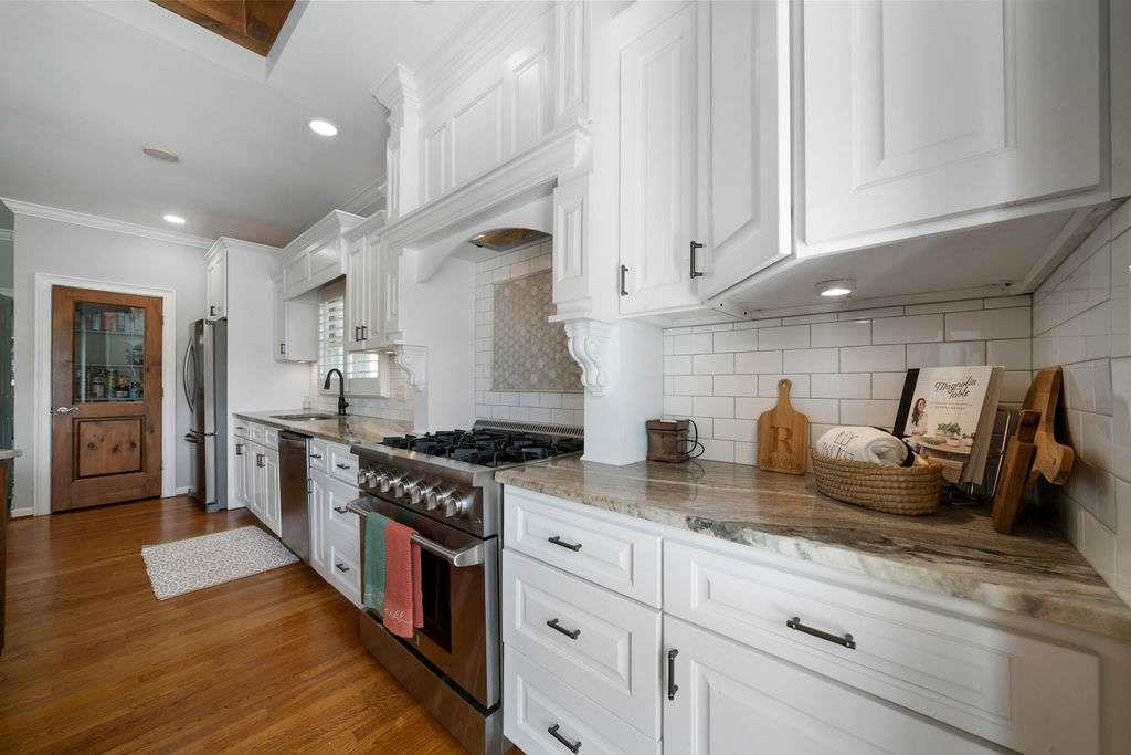 111 Warwick Way Rome, GA 30161 - Photo 15 of 46 a kitchen with counter top space cabinets and stainless steel appliances