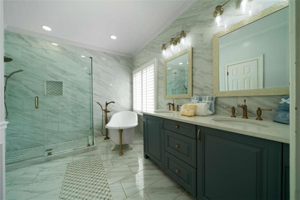 111 Warwick Way Rome, GA 30161 - Photo 19 of 46 a spacious bathroom with a shower sink and mirror