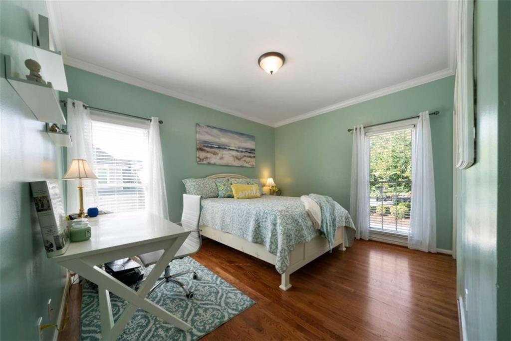 111 Warwick Way Rome, GA 30161 - Photo 21 of 46 a bedroom with a bed window and a table