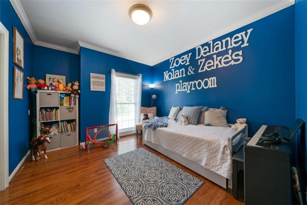 111 Warwick Way Rome, GA 30161 - Photo 23 of 46 a bed room with a bed and a book shelf