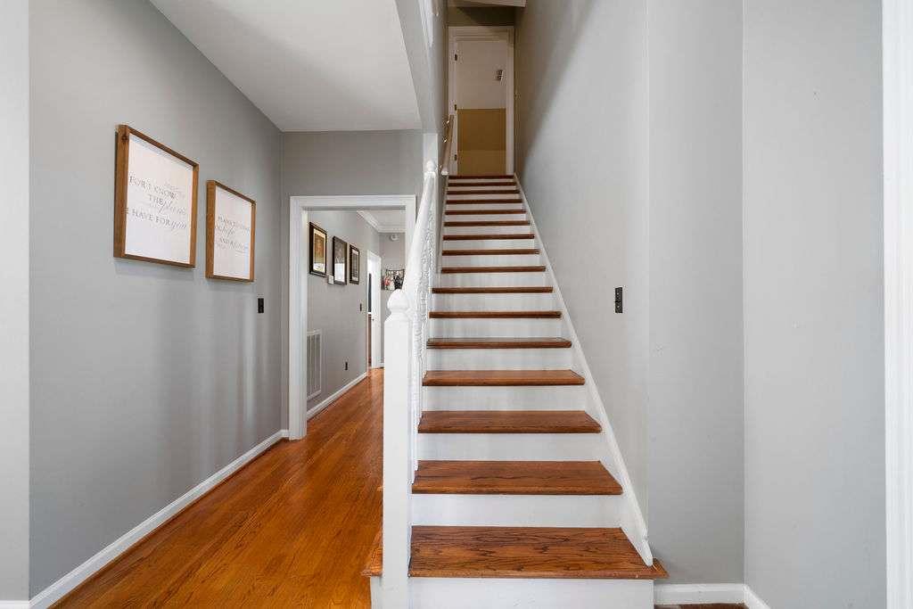 111 Warwick Way Rome, GA 30161 - Photo 24 of 46 a view of staircase with wooden floor and white walls