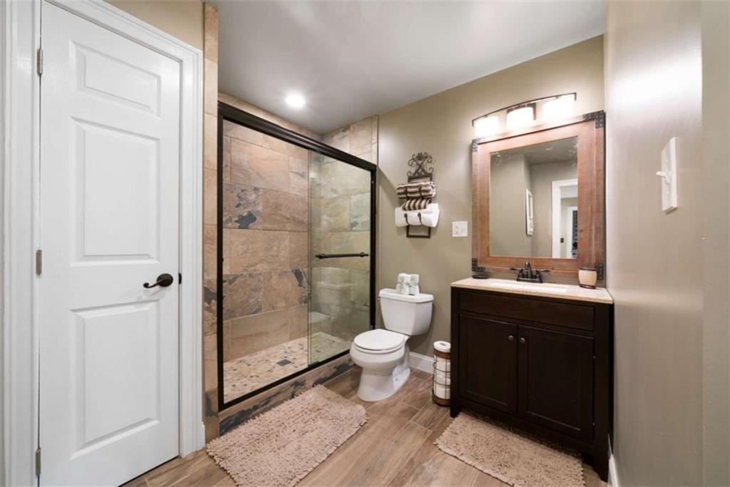 111 Warwick Way Rome, GA 30161 - Photo 32 of 46 a bathroom with a sink and a mirror