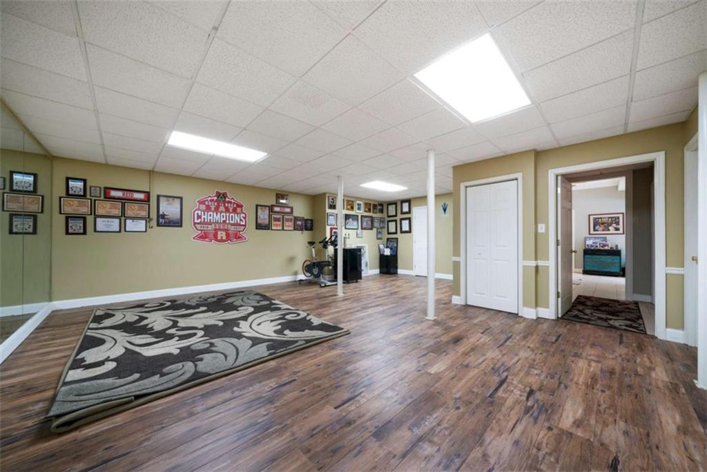 111 Warwick Way Rome, GA 30161 - Photo 35 of 46 a view of a living room and kitchen with furniture wooden floor and window