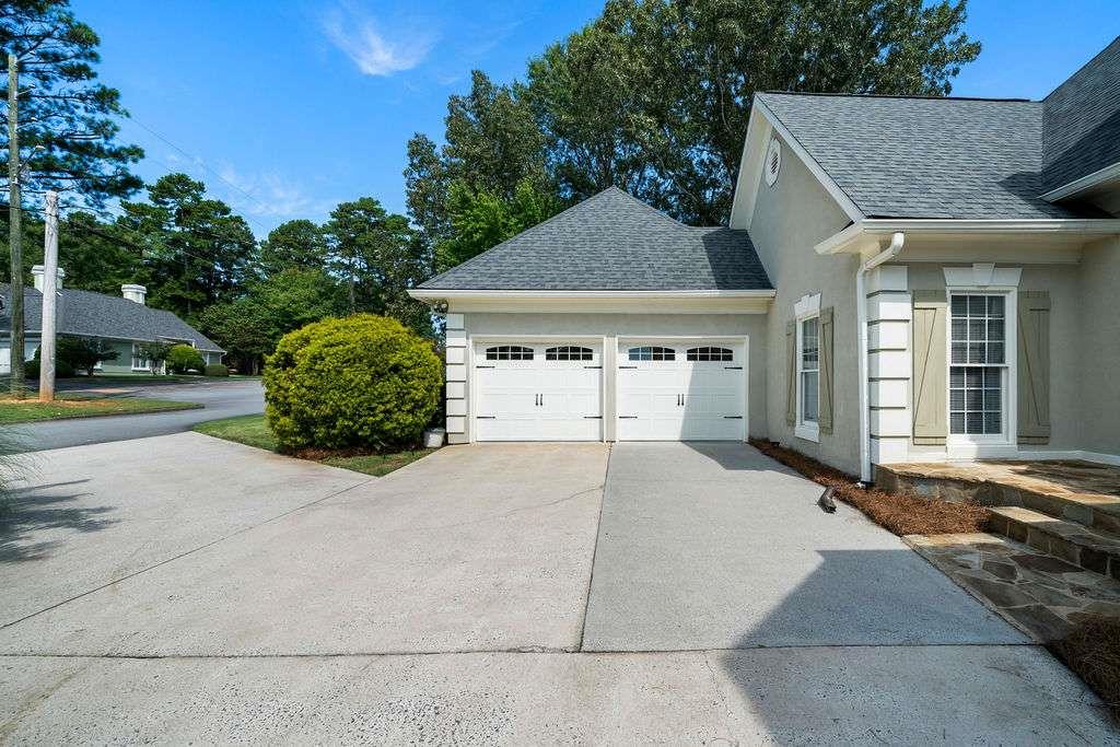 111 Warwick Way Rome, GA 30161 - Photo 41 of 46 a front view of a house with a yard and garage
