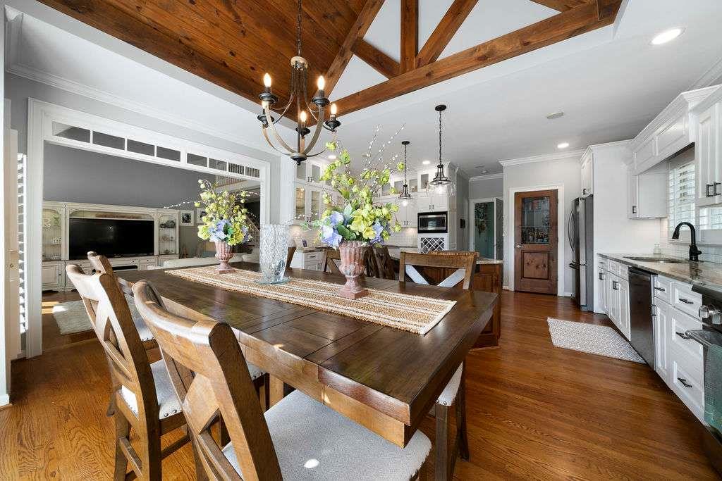 111 Warwick Way Rome, GA 30161 - Photo 10 of 46 a view of a dining room and livingroom with furniture wooden floor a chandelier