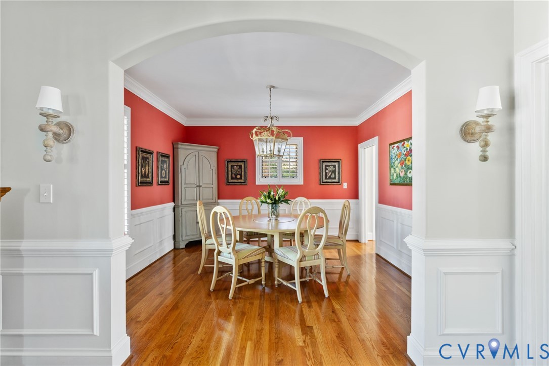 8947 Cherokee Road Richmond, VA 23235 - Photo 7 of 45 a view of a dining room with furniture window and wooden floor