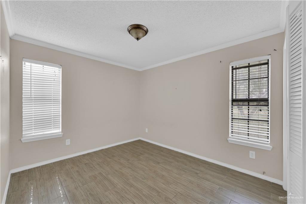 314 Santa Ana Avenue Rancho Viejo, TX 78575 - Photo 16 of 30 an empty room with windows