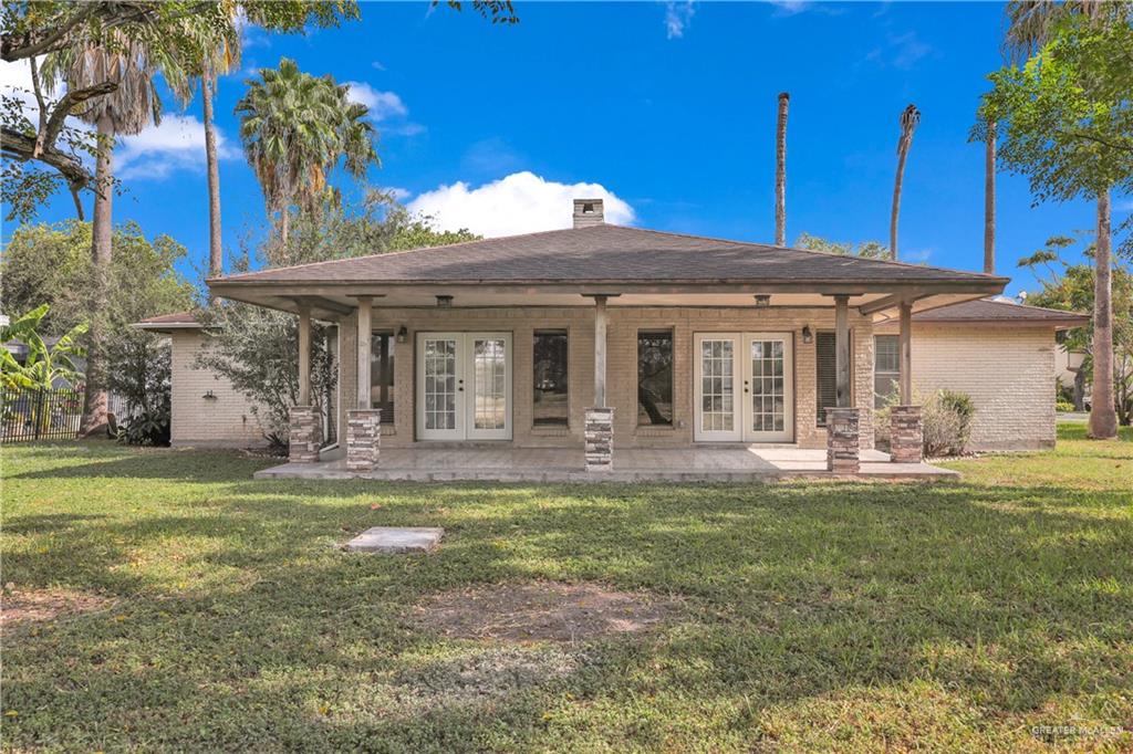 314 Santa Ana Avenue Rancho Viejo, TX 78575 - Photo 20 of 30 a front view of a house with a garden and patio
