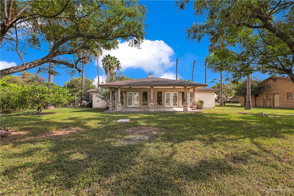 314 Santa Ana Avenue Rancho Viejo, TX 78575 - Photo 21 of 30 a view of a house with a yard