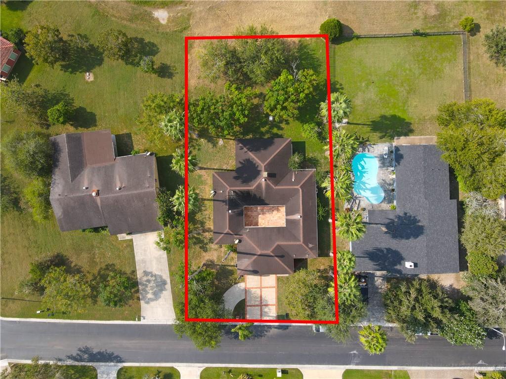 314 Santa Ana Avenue Rancho Viejo, TX 78575 - Photo 23 of 30 an aerial view of houses with yard