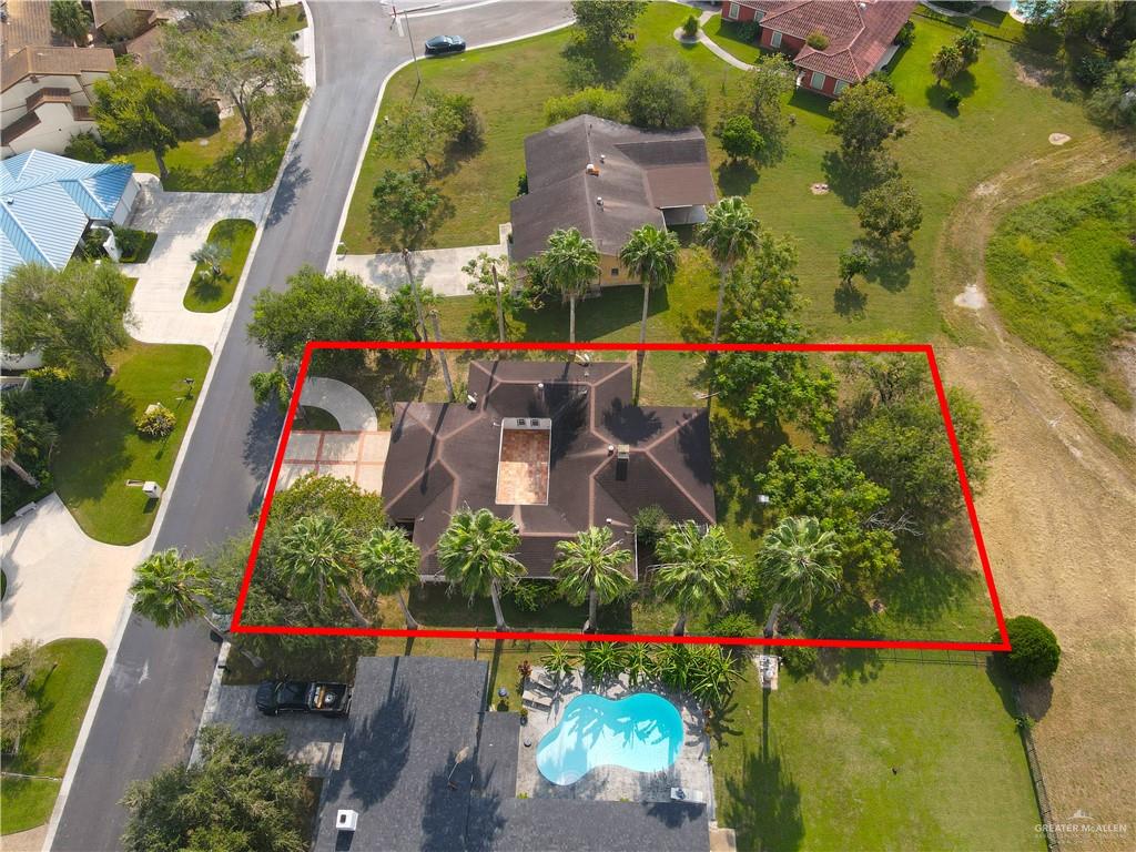 314 Santa Ana Avenue Rancho Viejo, TX 78575 - Photo 25 of 30 an aerial view of swimming pool playground and residential houses with outdoor space