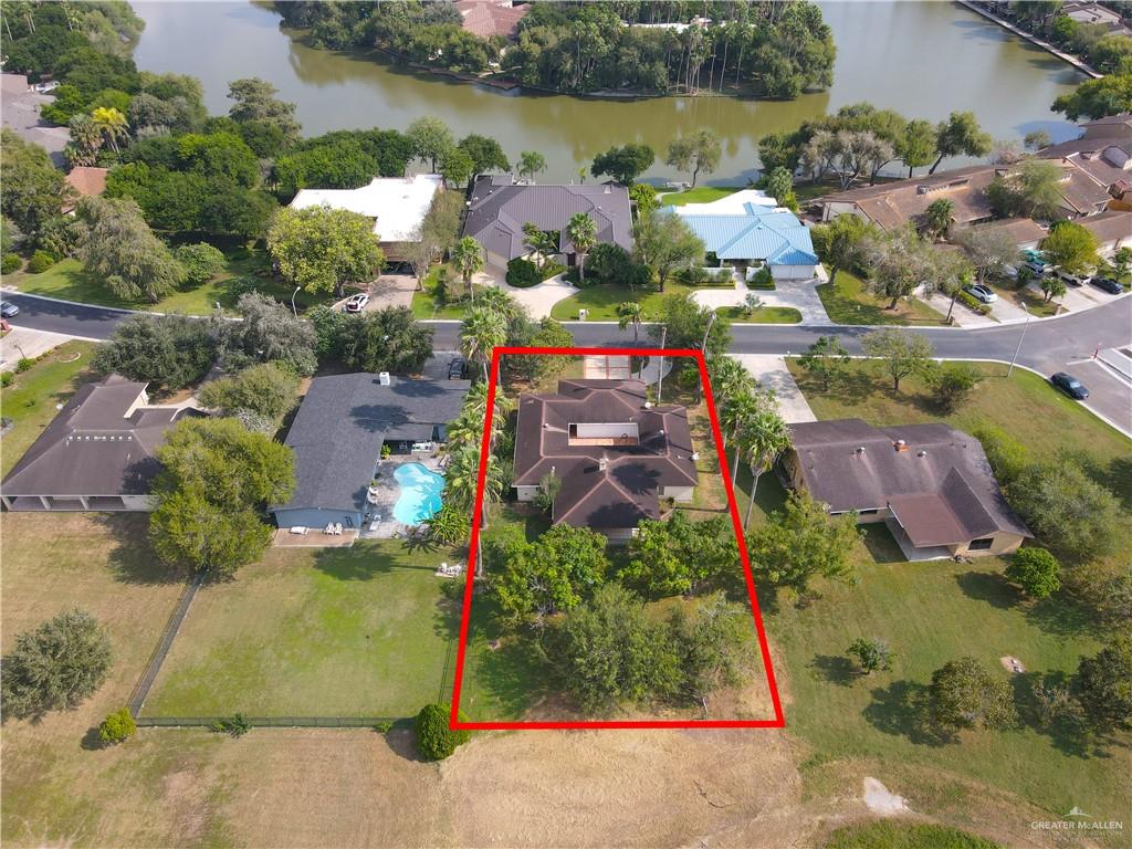 314 Santa Ana Avenue Rancho Viejo, TX 78575 - Photo 27 of 30 an aerial view of a houses with outdoor space