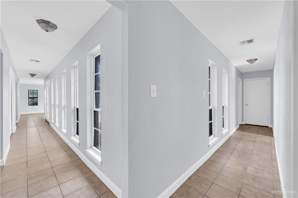 314 Santa Ana Avenue Rancho Viejo, TX 78575 - Photo 9 of 30 a view of a hallway with a hallway