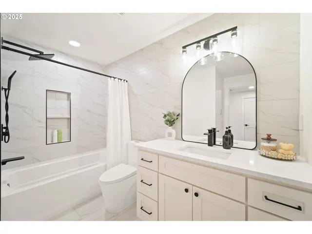 a bedroom with a large bed and a large window