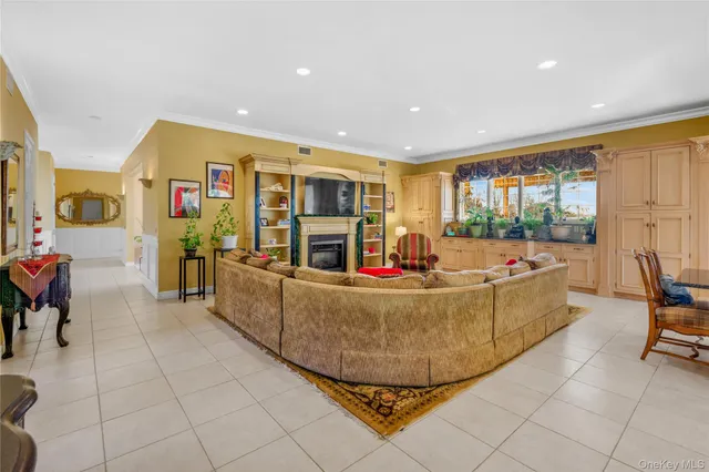 a bedroom with furniture and a large window