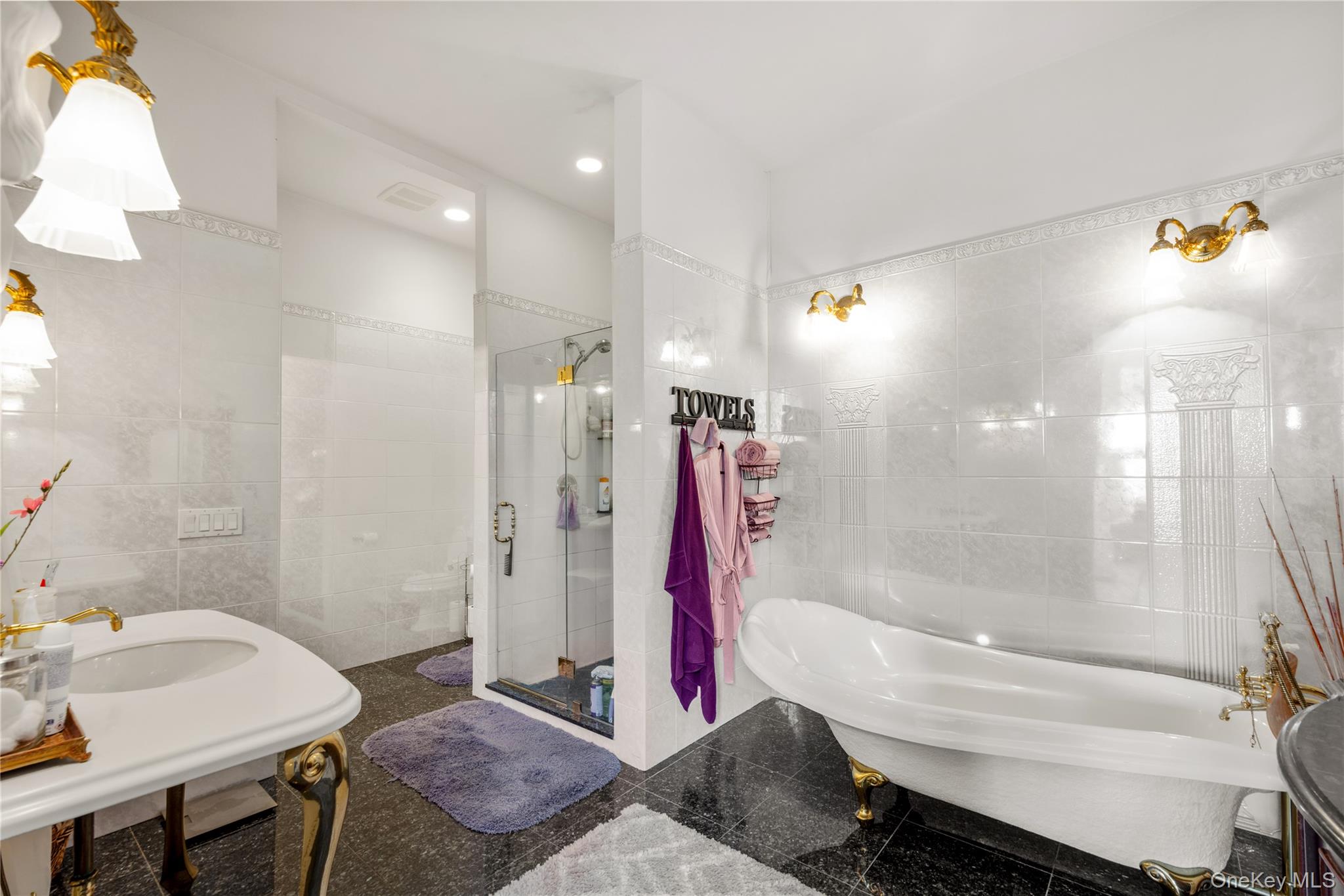 28 Old Neck Road South Center Moriches, NY 11934 - Photo 14 of 43 a bathroom with a bathtub and a sink