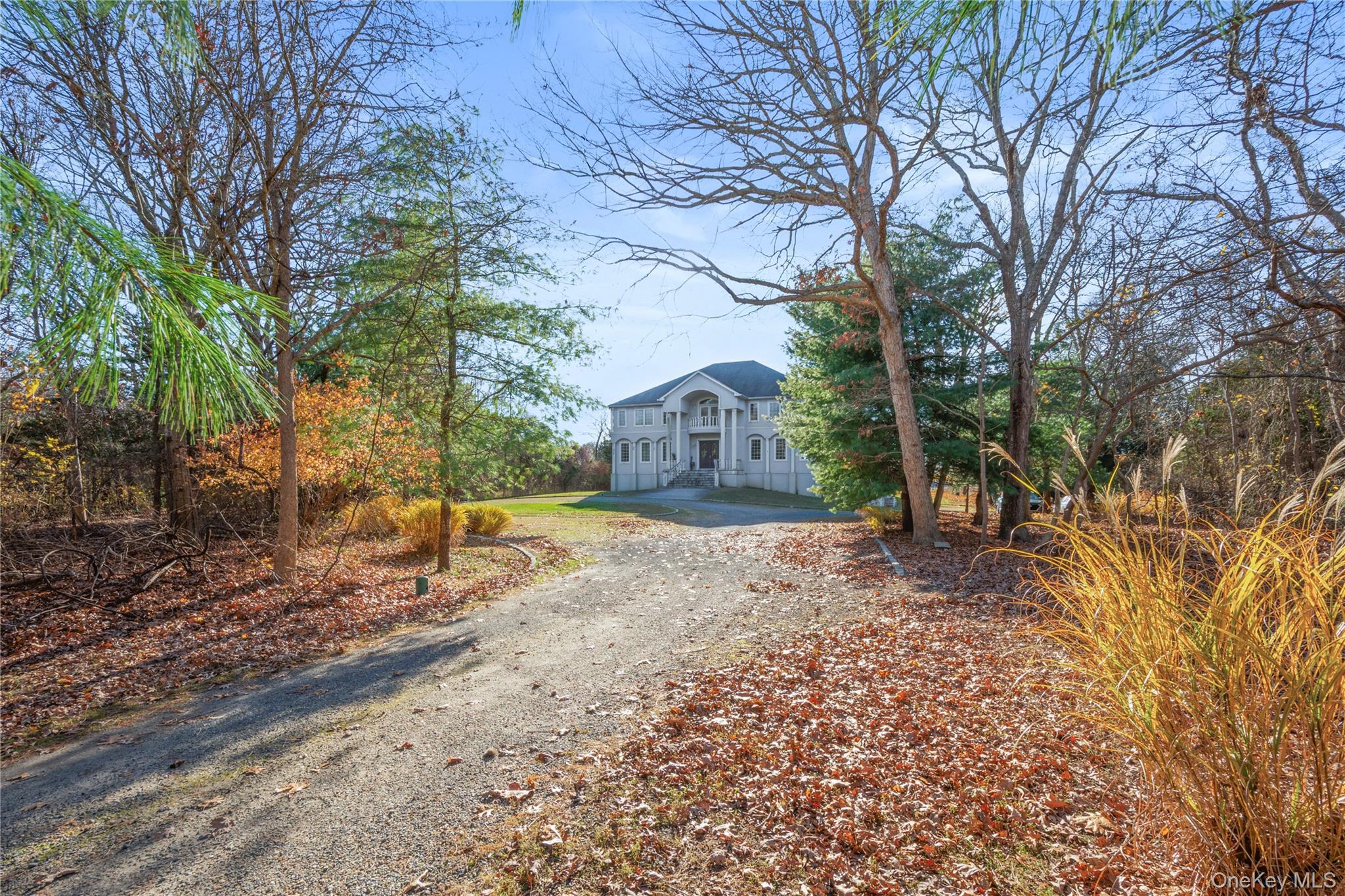 28 Old Neck Road South Center Moriches, NY 11934 - Photo 2 of 43 a view of house with a trees in the background
