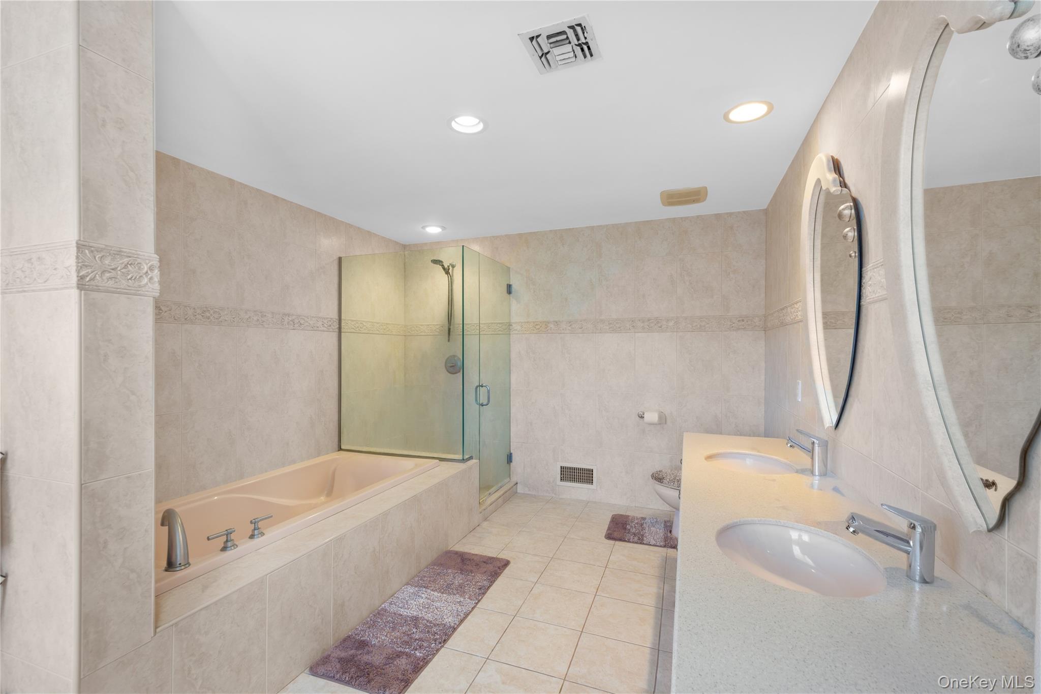 28 Old Neck Road South Center Moriches, NY 11934 - Photo 21 of 43 a bathroom with a tub a toilet and a shower