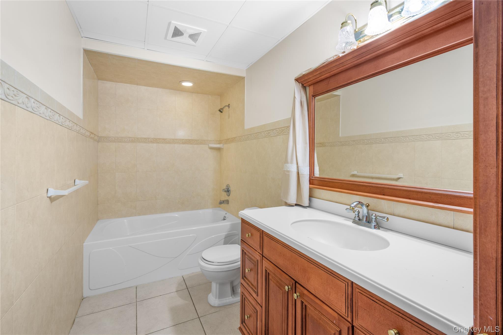28 Old Neck Road South Center Moriches, NY 11934 - Photo 26 of 43 a bathroom with a sink a toilet and shower