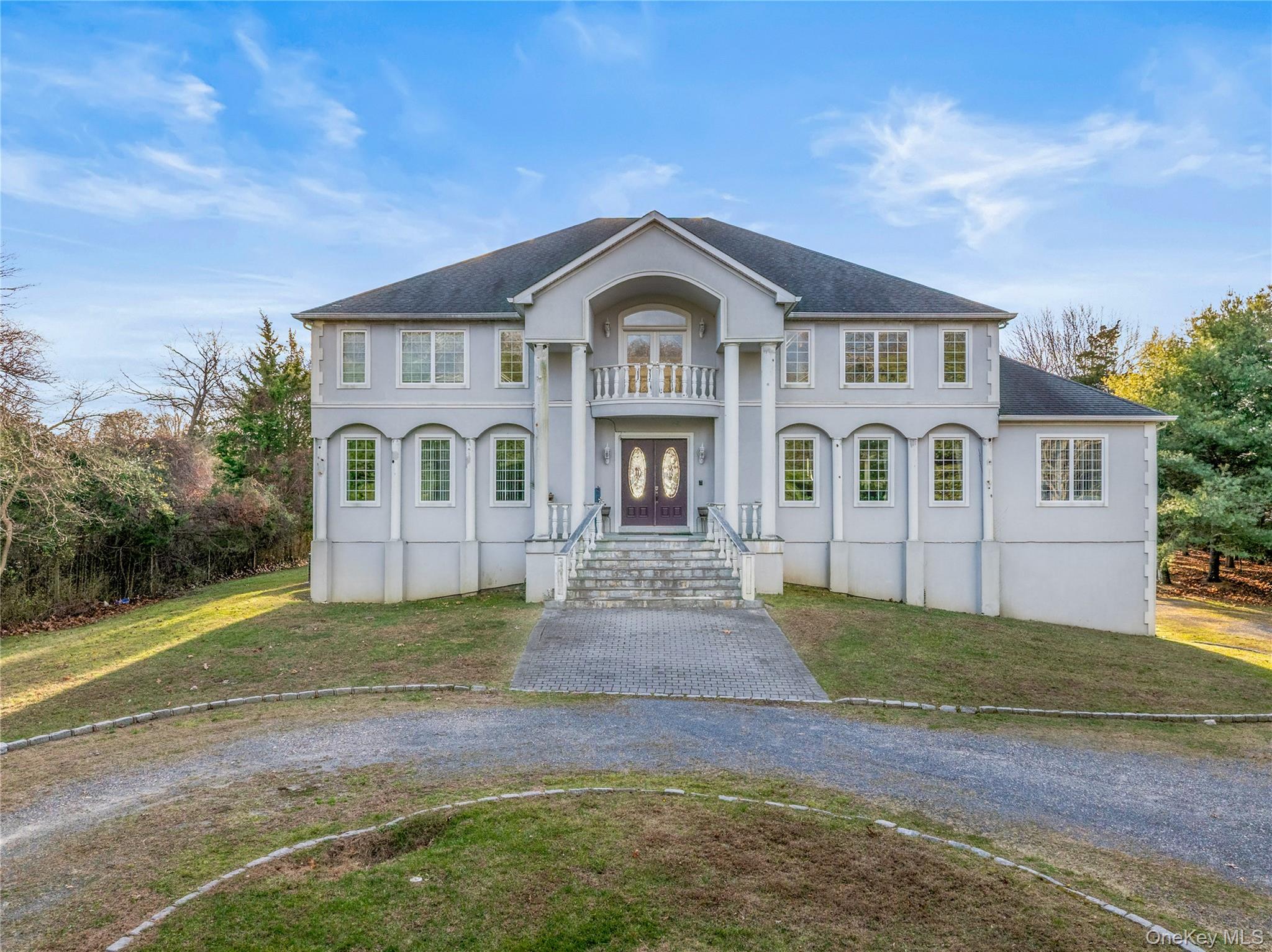 28 Old Neck Road South Center Moriches, NY 11934 - Photo 3 of 43 a front view of a house with a yard