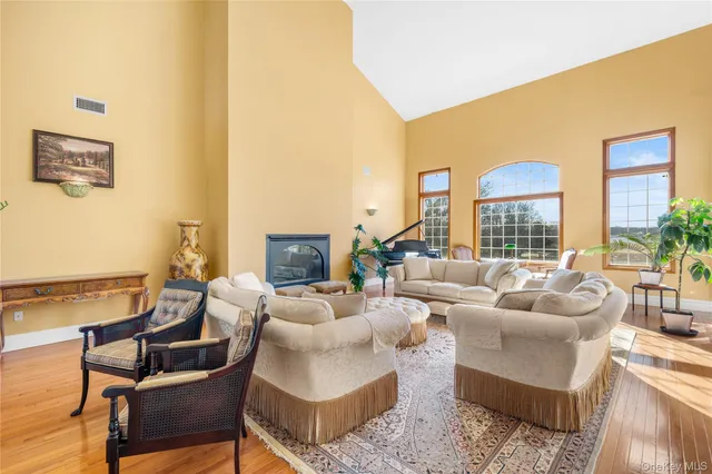 a dining hall with stainless steel appliances a table and chairs