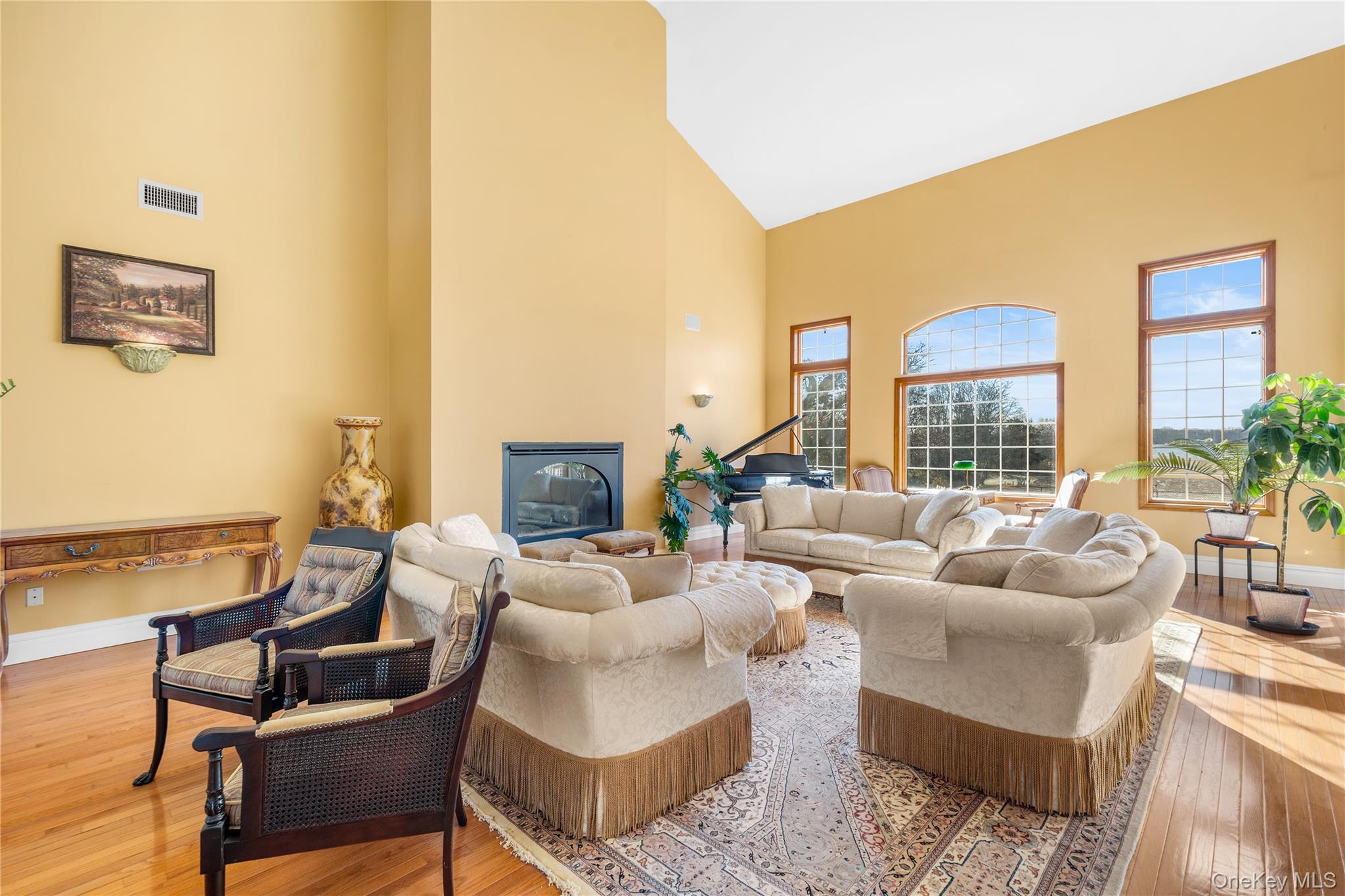 28 Old Neck Road South Center Moriches, NY 11934 - Photo 7 of 43 a living room with furniture and a floor to ceiling window