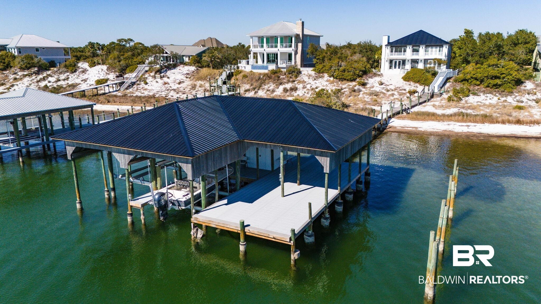 30194 River Road Orange Beach, AL 36561 - Photo 36 of 45 Dock featuring boat lift and a water view