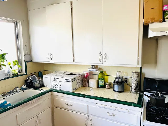 a bedroom with a bed and windows