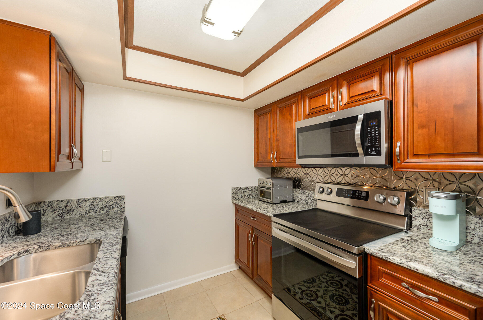 641 Ridge Club Drive, Unit 21 Melbourne, FL 32934 - Photo 12 of 23 Updated Kitchen