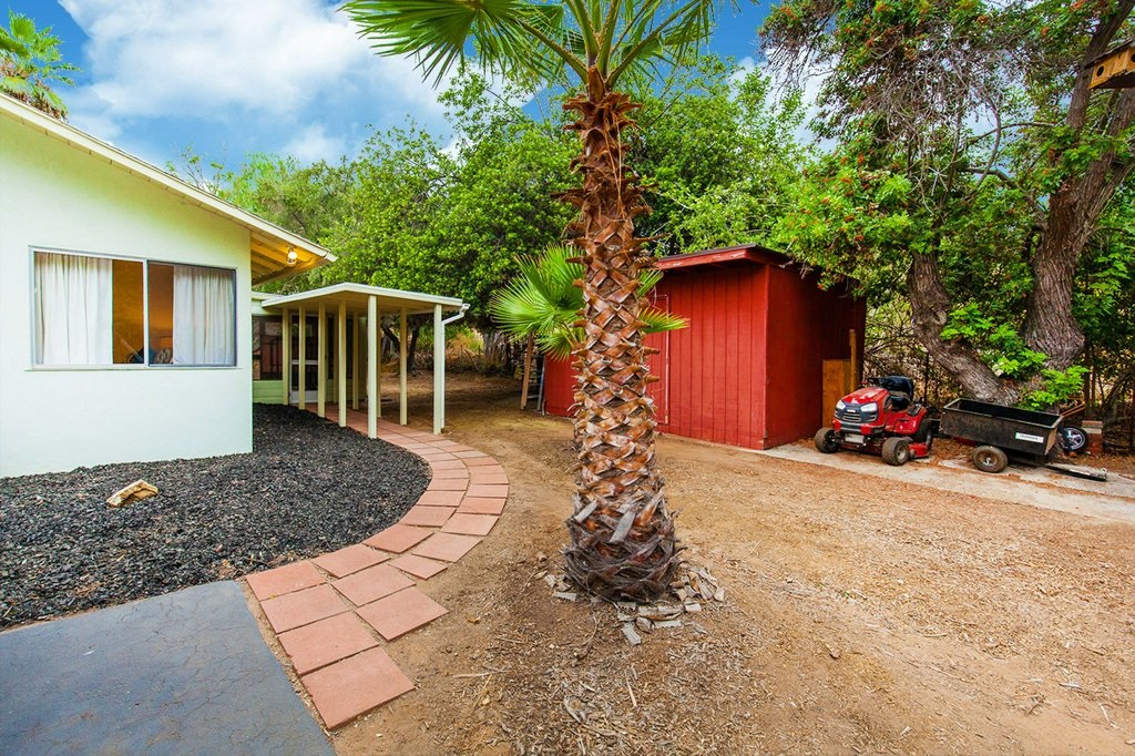 1900 Winrow Road El Cajon, CA 92021 - Photo 20 of 25 side shot of home exterior showing one of 4 sheds