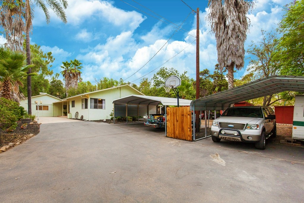 1900 Winrow Road El Cajon, CA 92021 - Photo 22 of 25 carport parking fits 4 large trucks with ample parking on long private enclosed driveway