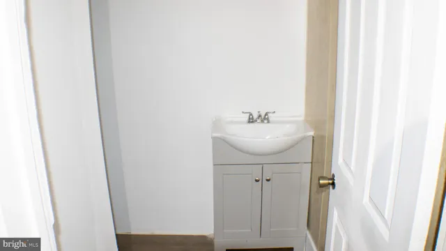 a bathroom with a toilet and a sink