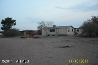 17521 West Chinle Road Marana, AZ 85653 - Photo 1 of 1 a view of a house with a back yard