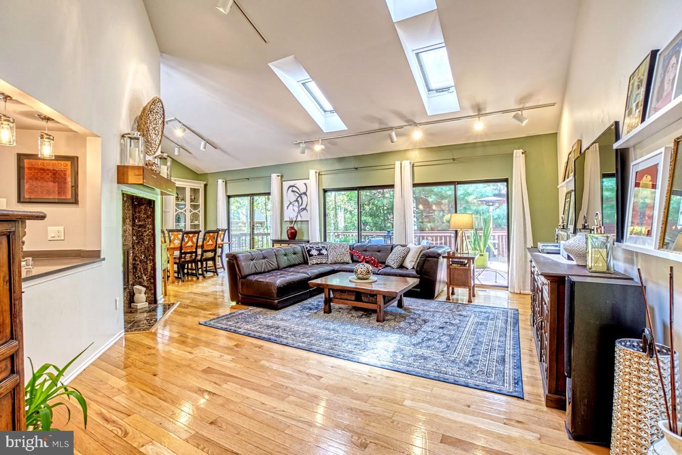 2122 South Bay Lane Reston, VA 20191 - Photo 6 of 41 Double sided fireplace and 3 sliders to the deck