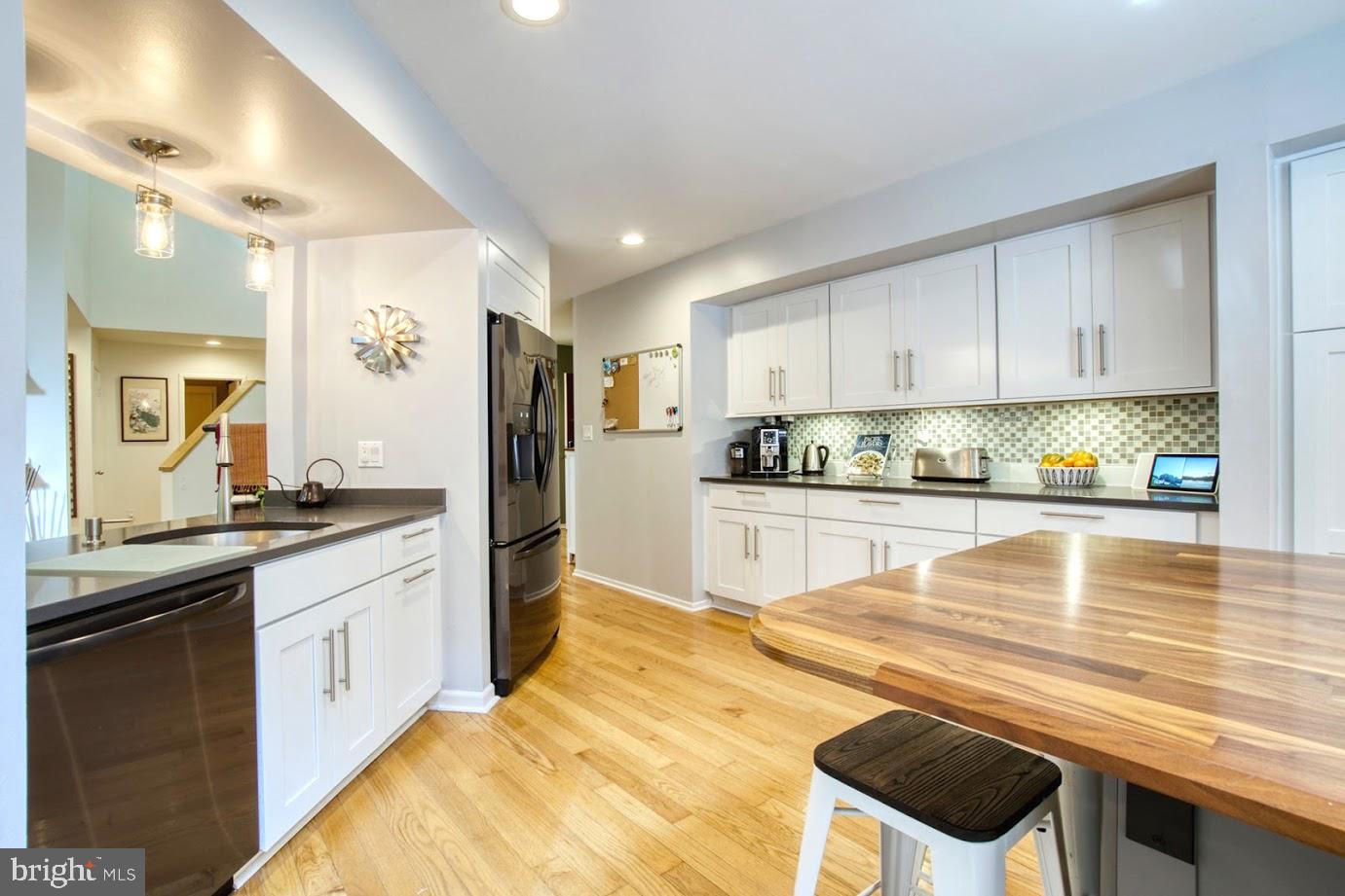 2122 South Bay Lane Reston, VA 20191 - Photo 7 of 41 Remodeled kitchen features Black SS appliances