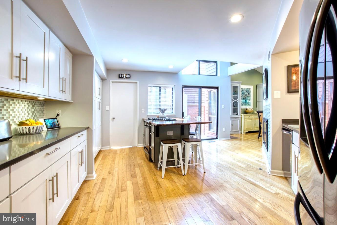 2122 South Bay Lane Reston, VA 20191 - Photo 8 of 41 White cabinets, Silestone and custom wood counters