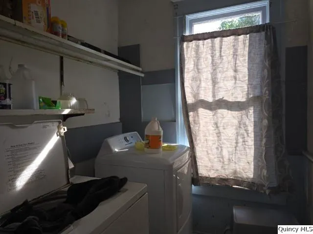 a utility room with a sink a washer and dryer