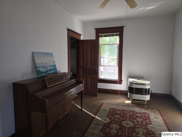 102 Center Street Augusta, IL 62311 - Photo 2 of 31 a living room with a couch and a fireplace
