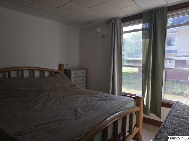 102 Center Street Augusta, IL 62311 - Photo 26 of 31 a bedroom with a bed next to a large window