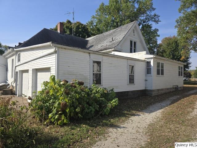 102 Center Street Augusta, IL 62311 - Photo 31 of 31 a front view of a house with garden