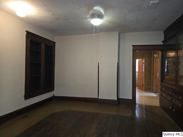 102 Center Street Augusta, IL 62311 - Photo 4 of 31 wooden floor in an empty room