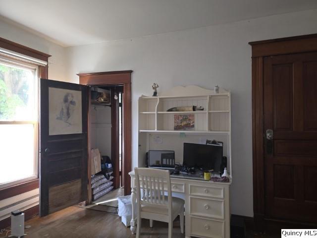 102 Center Street Augusta, IL 62311 - Photo 7 of 31 a work room with furniture a flat screen tv and a fireplace