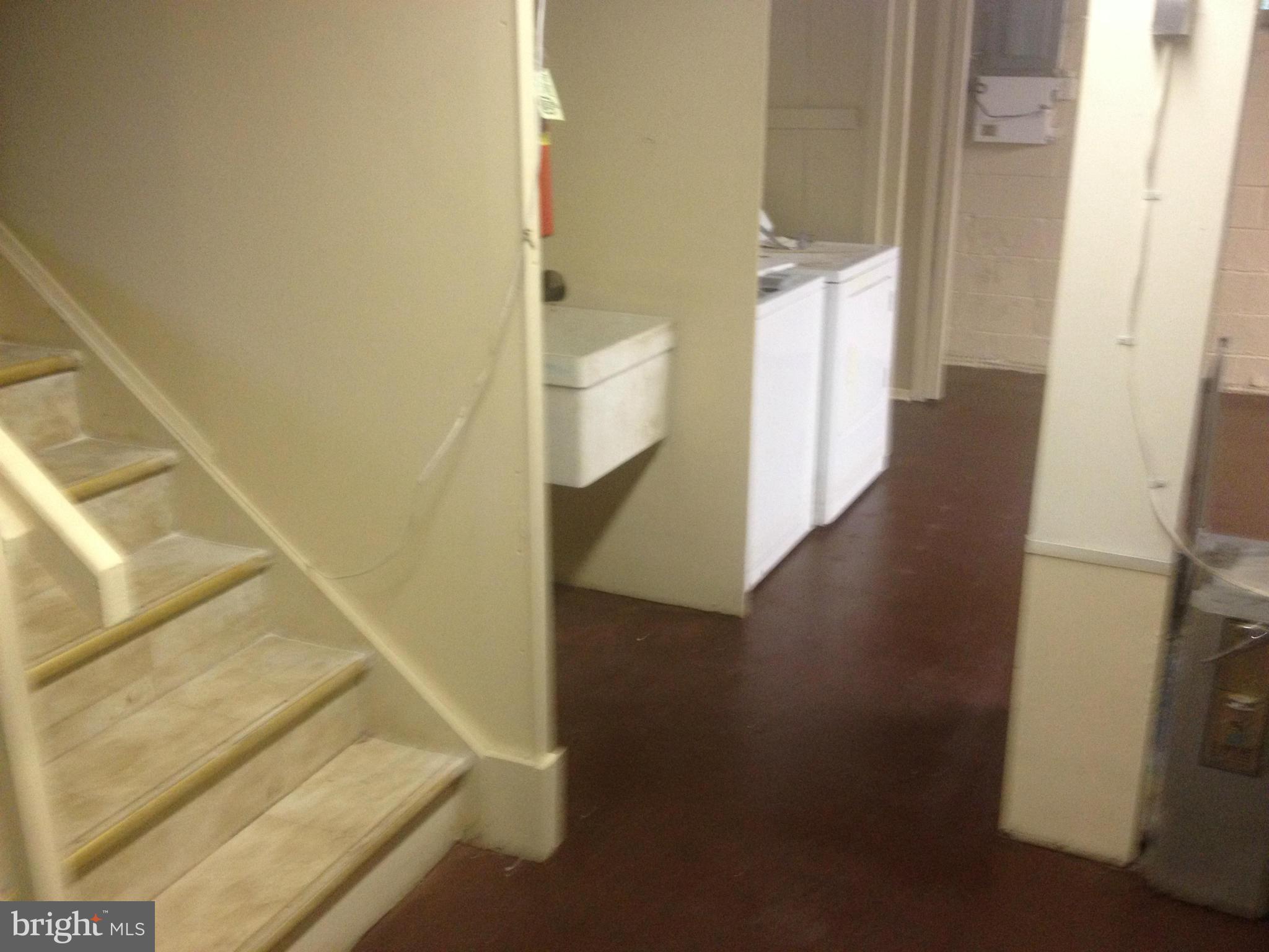 4600 Hawksbury Road Pikesville, MD 21208 - Photo 11 of 17 a view of a hallway with wooden floor and entryway
