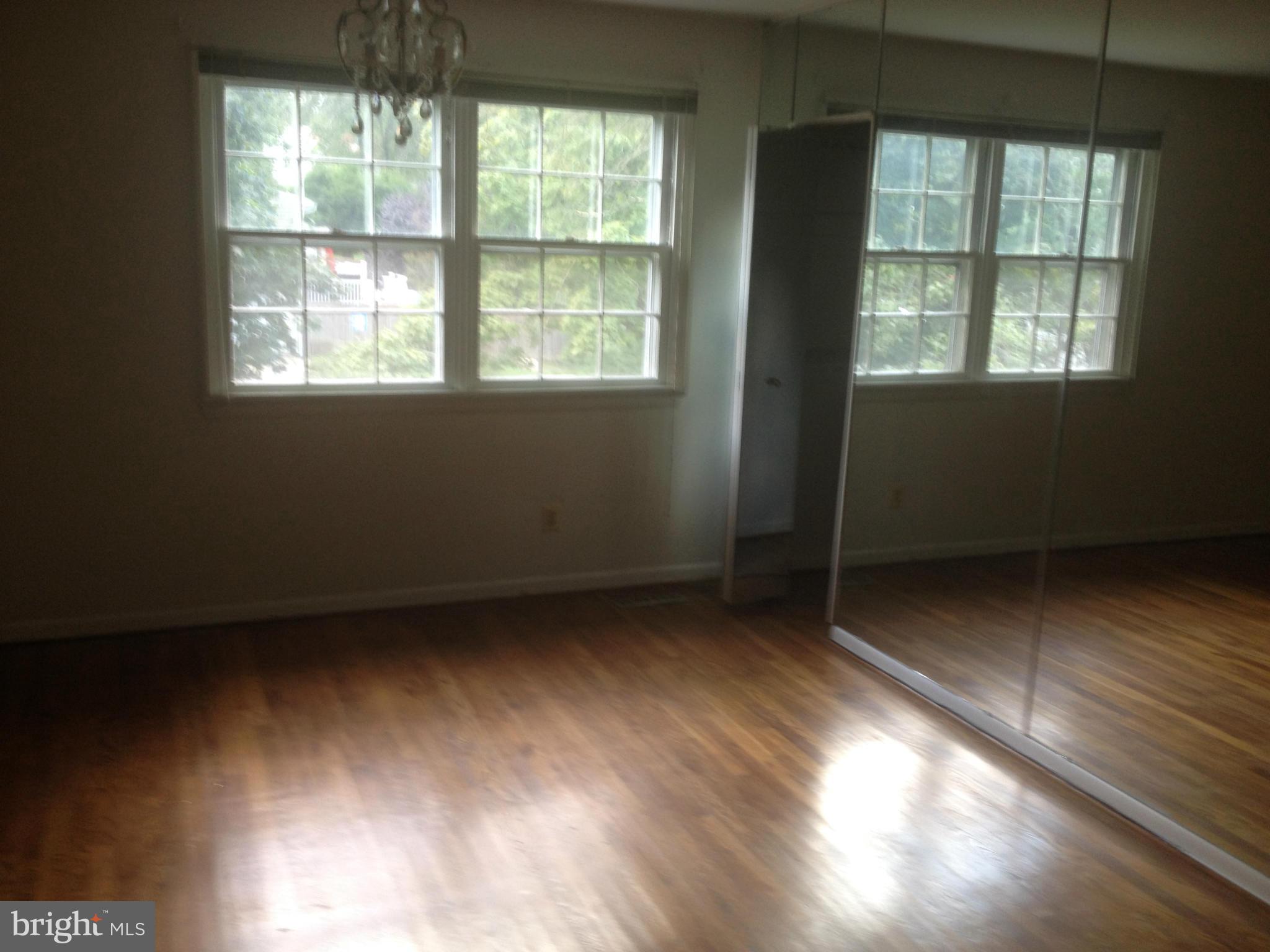 4600 Hawksbury Road Pikesville, MD 21208 - Photo 3 of 17 a view of an empty room with a window