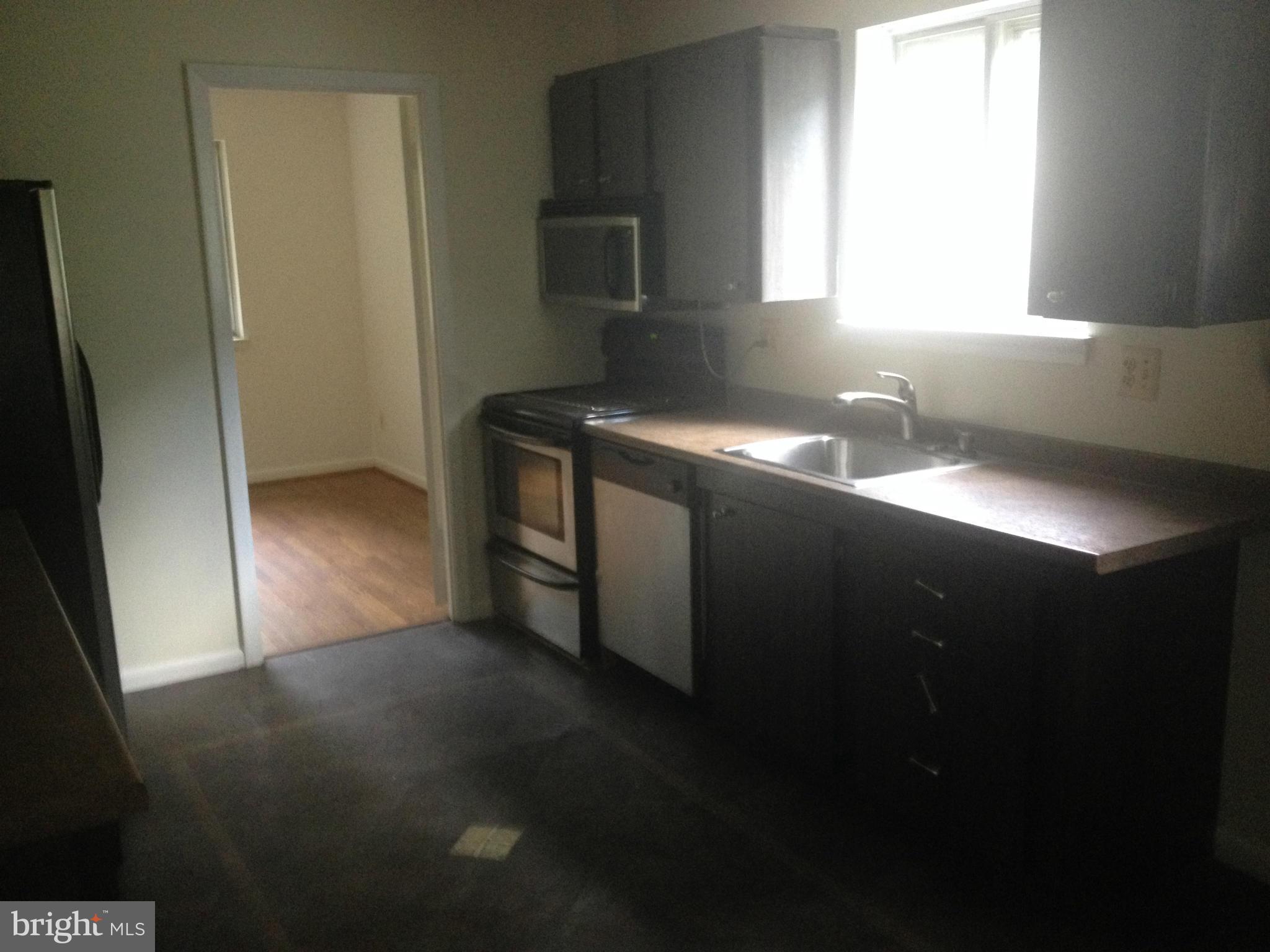 4600 Hawksbury Road Pikesville, MD 21208 - Photo 4 of 17 a kitchen with windows and sink