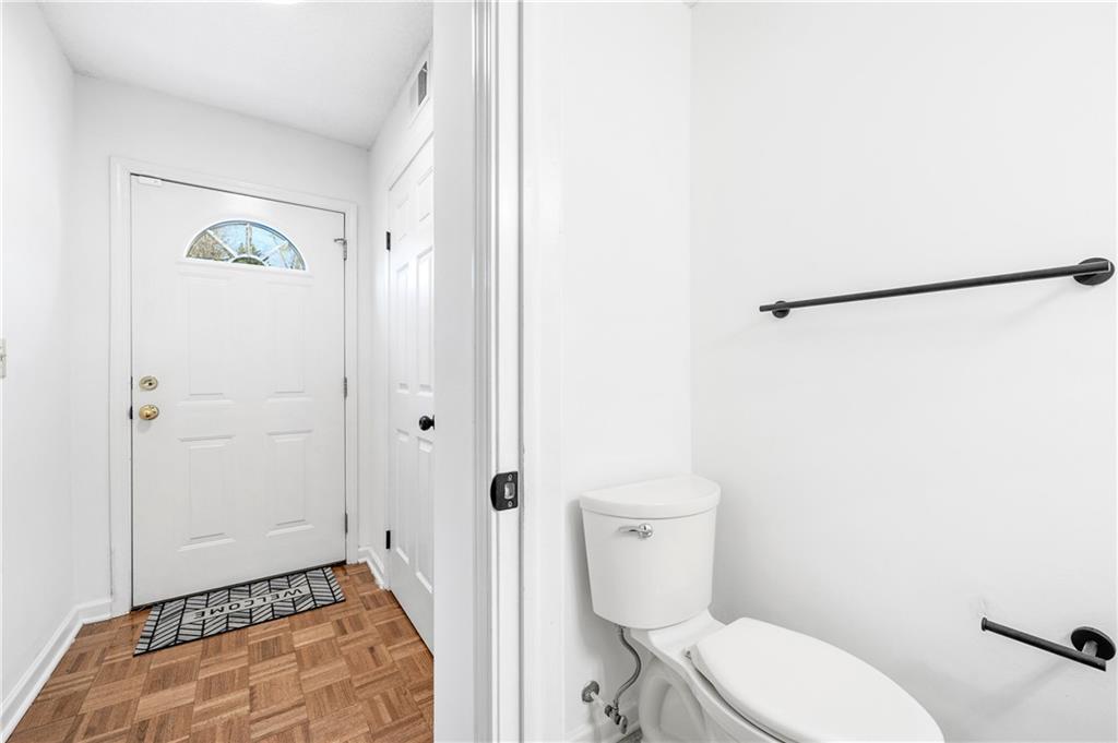 2883 Dresden Square Drive Atlanta, GA 30341 - Photo 11 of 30 a white toilet sitting next to a bathroom sink