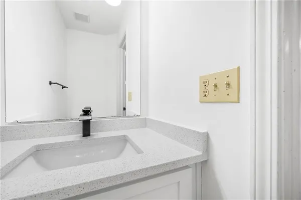 a bathroom with a sink and a vanity
