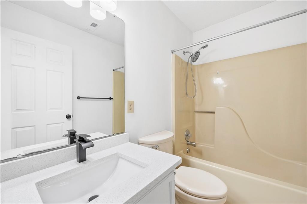 2883 Dresden Square Drive Atlanta, GA 30341 - Photo 17 of 30 a bathroom with a sink toilet and shower